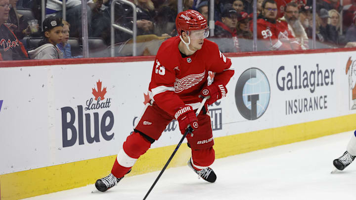 Feb 8, 2025; Detroit, Michigan, USA;  Detroit Red Wings left wing Lucas Raymond (23) skates with the puck in the second period against the Tampa Bay Lightning at Little Caesars Arena. Mandatory Credit: Rick Osentoski-Imagn Images
