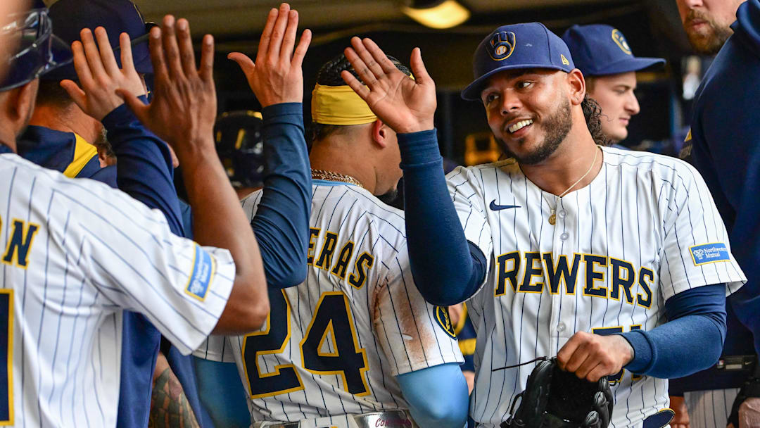 Jul 13, 2025; Milwaukee, Wisconsin, USA;  Milwaukee Brewers starting pitcher Freddy Peralta (51) is greeted in the dugout after pitching six plus innings against the Washington Nationals at American Family Field. Mandatory Credit: Benny Sieu-Imagn Images