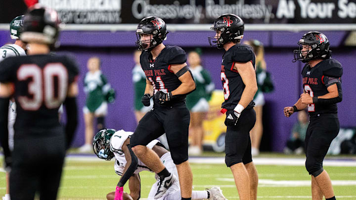 North Polk's Jakob Phillips (11) celebrates a stop against Pella's Emmanuel Diers (1) on Thursday, Nov. 21, 2024, at the UNI-Dome in Cedar Falls, Iowa. North Polk's Jakob Phillips (11) celebrates a stop against Pella's Emmanuel Diers (1) on Thursday, Nov. 21, 2024, at the UNI-Dome in Cedar Falls, Iowa.