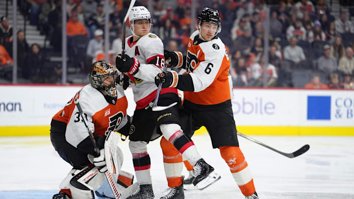 Nov 8, 2025; Philadelphia, Pennsylvania, USA; Philadelphia Flyers defenseman Travis Sanheim (6) hits Ottawa Senators center Tim Stutzle (18) in the third period at Xfinity Mobile Arena. Mandatory Credit: Kyle Ross-Imagn Images