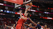 Nov 11, 2024; Houston, Texas, USA;  Houston Rockets center Alperen Sengun (28) grabs an offensive rebound then scores against the Washington Wizards in the first quarter at Toyota Center. Mandatory Credit: Thomas Shea-Imagn Images