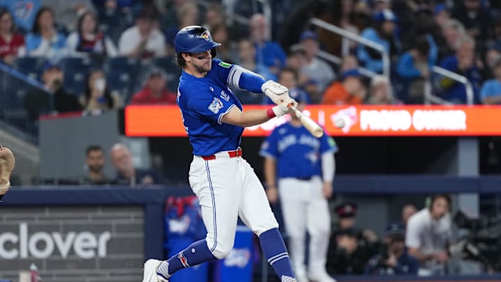 Apr 25, 2026; Toronto, Ontario, CAN; Toronto Blue Jays second baseman Ernie Clement (22) hits a double against the Cleveland Guardians during the first inning at Rogers Centre. Mandatory Credit: Nick Turchiaro-Imagn Images