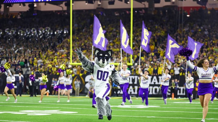 Jan 8, 2024; Houston, TX, USA; Washington Huskies mascot Harry the Husky runs onto the field before the 2024 College Football Playoff national championship game against the Michigan Wolverines at NRG Stadium. Mandatory Credit: Mark J. Rebilas-USA TODAY Sports