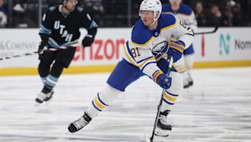 Mar 20, 2025; Salt Lake City, Utah, USA; Buffalo Sabres center Sam Lafferty (81) skates with the puck against the Utah Hockey Club during the first period at Delta Center. Mandatory Credit: Rob Gray-Imagn Images