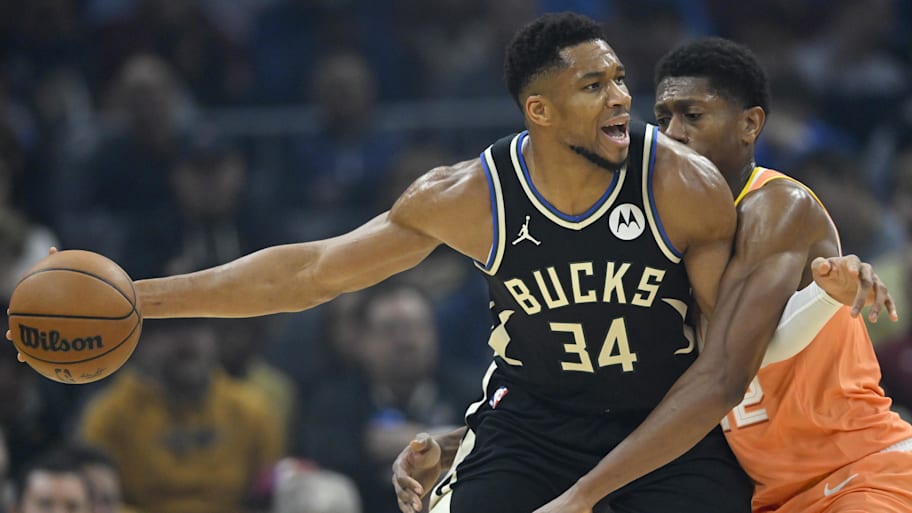 Giannis Antetokounmpo dribbles the ball