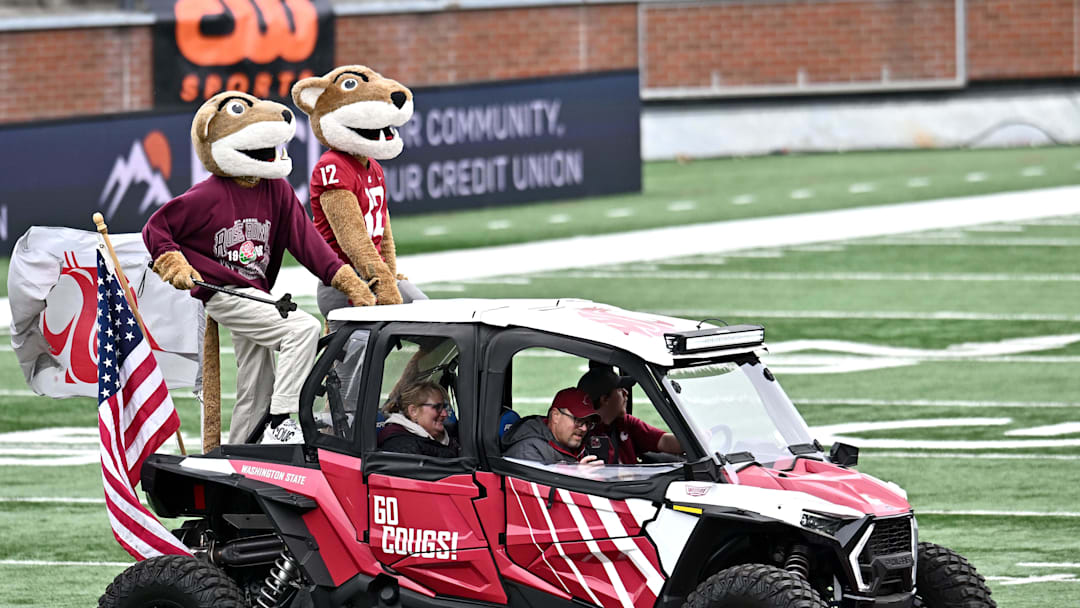 Oct 25, 2025; Pullman, Washington, USA;  Washington State Cougars mascots, Paw Paw, left and Butch ride out onto the field before a game against the Toledo Rockets at Gesa Field at Martin Stadium. Mandatory Credit: James Snook-Imagn Images