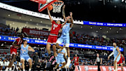 Feb 1, 2025; Houston, Texas, USA; Texas Tech Red Raiders forward Darrion Williams (5) goes to the basket as Houston Cougars guard Terrance Arceneaux (23) defends during the first half at Fertitta Center. Mandatory Credit: Maria Lysaker-Imagn Images 