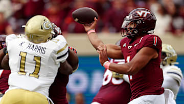 Oct 26, 2024; Blacksburg, Virginia, USA; Virginia Tech Hokies quarterback Kyron Drones (1) throws a pass during the first quarter against the Georgia Tech Yellow Jackets at Lane Stadium. Mandatory Credit: Peter Casey-Imagn Images