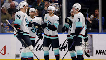 Jan 9, 2024; Buffalo, New York, USA;  Seattle Kraken center Matty Beniers (10) celebrates his goal with teammates during the second period against the Buffalo Sabres at KeyBank Center. Mandatory Credit: Timothy T. Ludwig-Imagn Images