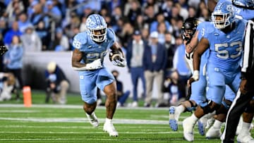 Nov 16, 2024; Chapel Hill, North Carolina, USA;  North Carolina Tar Heels running back Omarion Hampton (28) runs in the first quarter at Kenan Memorial Stadium. Mandatory Credit: Bob Donnan-Imagn Images