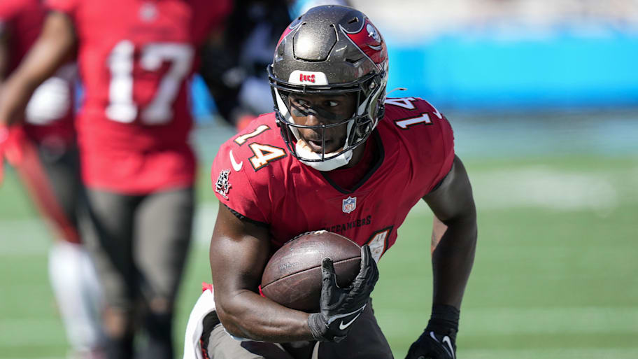 Oct 23, 2022; Charlotte, North Carolina, USA; Tampa Bay Buccaneers wide receiver Chris Godwin (14) runs for yards after catch during the first quarter against the Carolina Panthers at Bank of America Stadium. Mandatory Credit: Jim Dedmon-Imagn Images | Jim Dedmon-Imagn Images