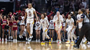 Mar 30, 2025; Birmingham, AL, USA; South Carolina Gamecocks forward Maryam Dauda (30) and South Carolina Gamecocks guard Maddy McDaniel (1) and South Carolina Gamecocks forward Chloe Kitts (21) lead their team onto the floor to celebrate after the South Carolina Gamecocks defeated the Duke Blue Devils at an Elite 8 NCAA Tournament basketball game at Legacy Arena. Mandatory Credit: Vasha Hunt-Imagn Images