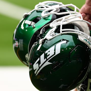 Oct 6, 2024; Tottenham, ENG; New York Jets helmets are held by staff before the match against Minnesota Vikings at Tottenham Hotspur Stadium. Mandatory Credit: Shaun Brooks-Imagn Images