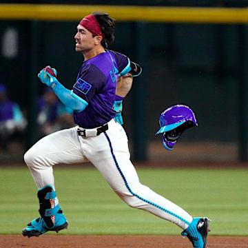 Diamondbacks outfielder Corbin Carroll (7) rounds second on the way to a triple against the Dodgers during a game at Chase Field on May 10, 2025, in Phoenix.