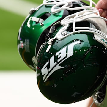 Oct 6, 2024; Tottenham, ENG; New York Jets helmets are held by staff before the match against Minnesota Vikings at Tottenham Hotspur Stadium. Mandatory Credit: Shaun Brooks-Imagn Images