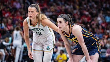 Jun 14, 2025; Indianapolis, Indiana, USA; New York Liberty guard Sabrina Ionescu (20) and Indiana Fever guard Caitlin Clark (22)  in the second half at Gainbridge Fieldhouse. Mandatory Credit: Trevor Ruszkowski-Imagn Images