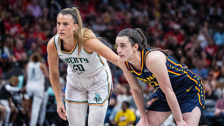 Jun 14, 2025; Indianapolis, Indiana, USA; New York Liberty guard Sabrina Ionescu (20) and Indiana Fever guard Caitlin Clark (22)  in the second half at Gainbridge Fieldhouse. Mandatory Credit: Trevor Ruszkowski-Imagn Images