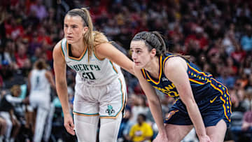 Jun 14, 2025; Indianapolis, Indiana, USA; New York Liberty guard Sabrina Ionescu (20) and Indiana Fever guard Caitlin Clark (22)  in the second half at Gainbridge Fieldhouse. Mandatory Credit: Trevor Ruszkowski-Imagn Images