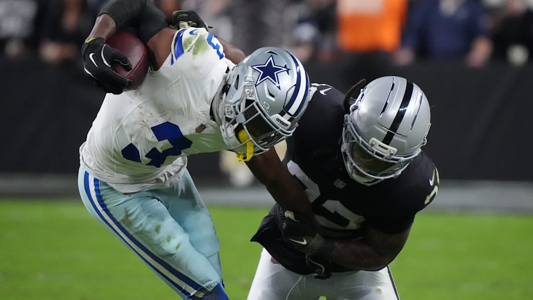 Las Vegas Raiders safety Lonnie Johnson Jr. (32) attempts to tackle Dallas Cowboys wide receiver George Pickens (3) during the second half at Allegiant Stadium last season.