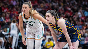 New York Liberty guard Sabrina Ionescu (20) and Indiana Fever guard Caitlin Clark (22)  in the second half at Gainbridge Fieldhouse.