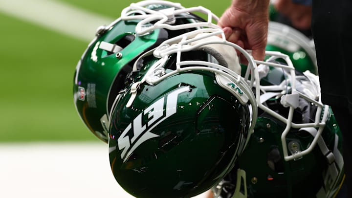 Oct 6, 2024; Tottenham, ENG; New York Jets helmets are held by staff before the match against Minnesota Vikings at Tottenham Hotspur Stadium. Mandatory Credit: Shaun Brooks-Imagn Images