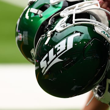 Oct 6, 2024; Tottenham, ENG; New York Jets helmets are held by staff before the match against Minnesota Vikings at Tottenham Hotspur Stadium. Mandatory Credit: Shaun Brooks-Imagn Images