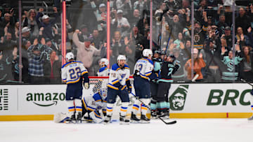Apr 12, 2025; Seattle, Washington, USA; The Seattle Kraken celebrate after a goal scored by center Shane Wright (51) during the third period against the St. Louis Blues at Climate Pledge Arena. Mandatory Credit: Steven Bisig-Imagn Images