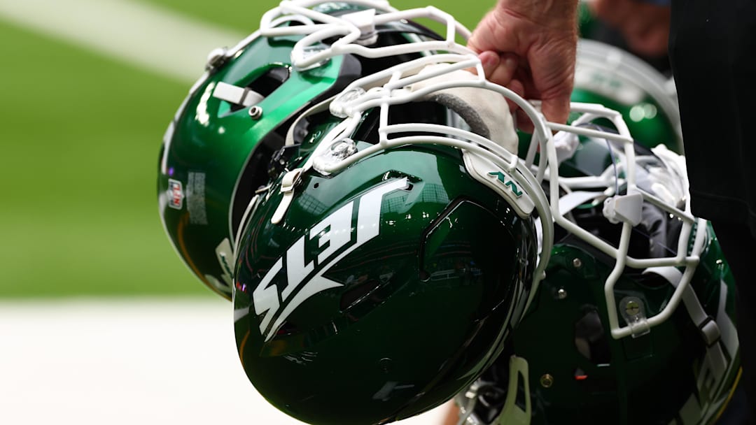 Oct 6, 2024; Tottenham, ENG; New York Jets helmets are held by staff before the match against Minnesota Vikings at Tottenham Hotspur Stadium. Mandatory Credit: Shaun Brooks-Imagn Images