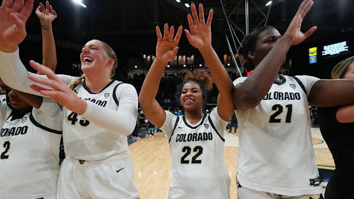 Feb 9, 2024; Boulder, Colorado, USA; Colorado Buffaloes guard Tameiya Sadler (2) and forward Charlotte Whittaker (45) and guard Shelomi Sanders (22) and center Aaronette Vonleh (21) celebrate defeating the Oregon Ducks in the second half at CU Events Center. Mandatory Credit: Ron Chenoy-Imagn Images