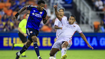 Oct 5, 2024; Cincinnati, Ohio, USA; FC Cincinnati defender Alvas Powell (2) dribbles against Orlando City SC forward Luis Muriel (9) in the second half at TQL Stadium. Mandatory Credit: Katie Stratman-Imagn Images