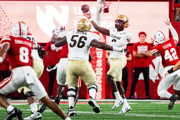 Colorado quarterback Shedeur Sanders throws away the ball during the Buffaloes' 2024 game against Nebraska.