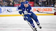 Feb 22, 2025; Toronto, Ontario, CAN;  Toronto Maple Leafs forward John Tavares (91) skates with the puck against the Carolina Hurricanes in the third period at Scotiabank Arena. Mandatory Credit: Dan Hamilton-Imagn Images