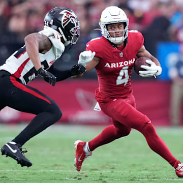Nov 12, 2023; Glendale, Arizona, USA; Arizona Cardinals wide receiver Rondale Moore (4) runs against Atlanta Falcons cornerback A.J. Terrell (24) during the first half at State Farm Stadium. Mandatory Credit: Joe Camporeale-Imagn Images