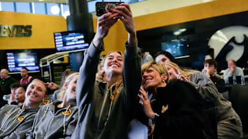 Iowa’s Lucy Olsen takes a team selfie during a watch party for the NCAA Women’s Basketball Tournament bracket reveal Sunday, March 16, 2025 at Carver-Hawkeye Arena in Iowa City, Iowa.