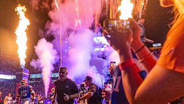 Florida Gators head coach Billy Napier runs out of the tunnel with the team as fireworks and fire shoot out of towers before the start of the game at Ben Hill Griffin Stadium in Gainesville, FL on Saturday, October 5, 2024. [Doug Engle/Gainesville Sun]