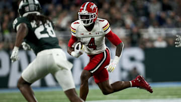 Maryland wide receiver Shaleak Knotts runs into Michigan State defensive back Dontavius Nash in second quarter.
