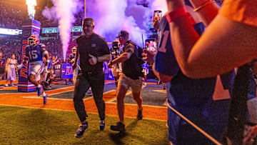 Florida Gators head coach Billy Napier runs out of the tunnel with the team as fireworks and fire shoot out of towers before the start of the game at Ben Hill Griffin Stadium in Gainesville, FL on Saturday, October 5, 2024. [Doug Engle/Gainesville Sun]