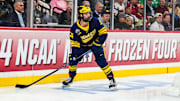 Apr 11, 2024; Saint Paul, Minnesota, USA; Michigan Wolverines defenseman Seamus Casey (26) looks to pass in the semifinals of the 2024 Frozen Four college ice hockey tournament during the second period against the Boston College Eagles at Xcel Energy Center. Mandatory Credit: Brace Hemmelgarn-Imagn Images
