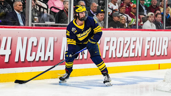 Apr 11, 2024; Saint Paul, Minnesota, USA; Michigan Wolverines defenseman Seamus Casey (26) looks to pass in the semifinals of the 2024 Frozen Four college ice hockey tournament during the second period against the Boston College Eagles at Xcel Energy Center. Mandatory Credit: Brace Hemmelgarn-Imagn Images