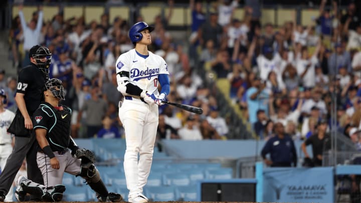 Jul 2, 2024; Los Angeles, California, USA;  Los Angeles Dodgers designated hitter Shohei Ohtani (17) hits a two-run home run during the seventh inning against the Arizona Diamondbacks at Dodger Stadium. Mandatory Credit: Kiyoshi Mio-USA TODAY Sports