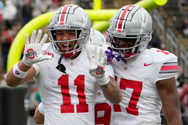 Wide receiver celebrates a touchdown with teammate.