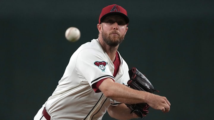 Jun 9, 2025; Phoenix, Arizona, USA; Arizona Diamondbacks pitcher Merrill Kelly (29) throws against the Seattle Mariners in the first inning at Chase Field. Mandatory Credit: Rick Scuteri-Imagn Images Jun 9, 2025; Phoenix, Arizona, USA; Arizona Diamondbacks pitcher Merrill Kelly (29) throws against the Seattle Mariners in the first inning at Chase Field. Mandatory Credit: Rick Scuteri-Imagn Images
