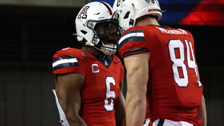 Oct 28, 2023; Tucson, Arizona, USA; Arizona Wildcats running back Michael Wiley #6 celebrates a touchdown with tight end Tanner McLachlan #84 during the second half at Arizona Stadium