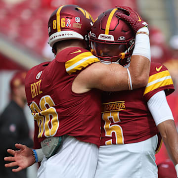 Sep 8, 2024; Tampa, Florida, USA; Washington Commanders quarterback Jayden Daniels (5) and tight end Zach Ertz (86) against the Tampa Bay Buccaneers prior to the game at Raymond James Stadium. Mandatory Credit: Kim Klement Neitzel-Imagn Images