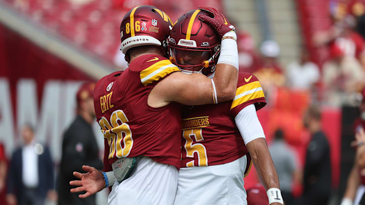 Sep 8, 2024; Tampa, Florida, USA; Washington Commanders quarterback Jayden Daniels (5) and tight end Zach Ertz (86) against the Tampa Bay Buccaneers prior to the game at Raymond James Stadium. Mandatory Credit: Kim Klement Neitzel-Imagn Images