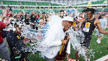 USC coach Quincy Watts is dunked by his team after a tie with Texas A&M for the team title on day three of the NCAA Outdoor Track and Field Championships on June 13, 2025, at Hayward Field in Eugene.