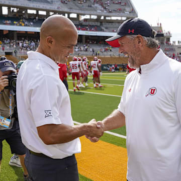 Baylor Bears head coach Dave Aranda and Utah Utes head coach Kyle Whittingham shake hands prior to a game at McLane Stadium.