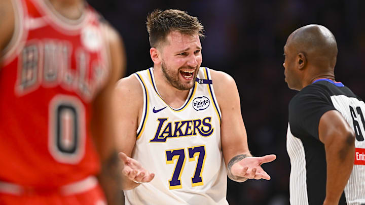 Mar 22, 2025; Los Angeles, California, USA; Los Angeles Lakers guard Luka Doncic (77) reacts to a call from referee Courtney Kirkland (61) against the Chicago Bulls during the second half at Crypto.com Arena. Mandatory Credit: Jonathan Hui-Imagn Images