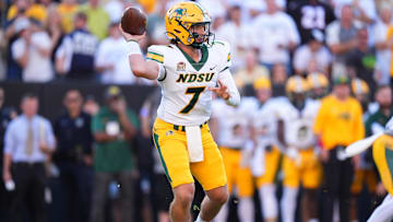 Aug 29, 2024; Boulder, Colorado, USA; North Dakota State Bison quarterback Cam Miller (7) scrambles in the second quarter against the Colorado Buffaloes at Folsom Field. Mandatory Credit: Ron Chenoy-Imagn Images