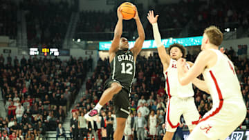 Jan 29, 2025; Starkville, Mississippi, USA; Mississippi State Bulldogs guard Josh Hubbard (12) shoots against the Alabama Crimson Tide during the second half at Humphrey Coliseum. Mandatory Credit: Wesley Hale-Imagn Images